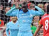 Manchester City forward Mario Balotelli lifts his shirt to reveal an imprinted message during the Premier League match against Manchester United at Old Trafford in England Oct. 23, 2011. [JOONGANG ILBO]