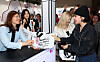 Jang Mi-ran, left, second vice minister of Culture, Sports and Tourism, and Lee Boo-jin, second from right, CEO of Hotel Shilla, who has been appointed as the chairperson of the Visit Korea Committee, hand out welcome bags to foreign visitors arriving at Incheon International Airport on Friday. [JOINT PRESS CORPS]