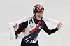 Rim Jong-un celebrates with the Korean national flag draped over his shoulders after securing the bronze medal in the men’s 1,000-meter short-track speed skating final at the 2026 Milan-Cortina Winter Olympics on Feb. 12. [KIM JONG-HO]