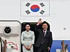 President Lee Jae-myung, right, and first lady Kim Hye-kyung greet onlookers at Seoul Air Base in Seongnam, Gyeonggi, before boarding the presidential jet bound for Canada on June 16. [YONHAP]