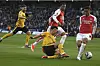 Wolverhampton Wanderers' Hwang Hee-chan, center, challenges for the ball with Arsenal's William Saliba, right, during a Premier League match at the Molineux in Wolverhampton, England on April 20. [AP/YONHAP]