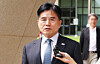 Rep. Yi Byeong-jin of the ruling Democratic Party walks out of the Suwon High Court in Suwon, Gyeonggi, on Aug. 28, 2025.  [YONHAP]