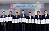 Khalid A. Radi, third from right, representative director of Aramco Korea, Kim Tae-kyoon, fourth from right, vice mayor of Seoul Metropolitan Government and other executives and officials from related companies take a photo after signing an agreement on the reusable plastic container program at Gocheok Sky Dome in Seoul on June 24. [ARAMCO KOREA]
