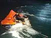 A group of crew members of a fishing vessel that sank in waters off Yeosu, South Jeolla, wait to be rescued by the Coast Guard aboard a life raft on Feb. 9. [COAST GUARD]