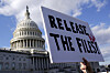 A protester holds a sign asking for the release of the Epstein files outside the U.S. Capitol in Washington on Nov. 12. [EPA/YONHAP]