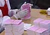 An official arranges stacks of ballots for the April 10 general election at the district election commission office in Seo District, Gwangju, on Wednesday. [YONHAP]