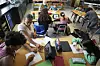 Art teacher Lindsay Johnson, second from left, teaches students how to ask ChatGPT for help during a summer class at Roosevelt Middle School in River Forest, Illinois, on June 25. [AP/YONHAP]