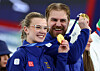 Gold medalists Rasmus Wranaa and Isabella Wranaa of Sweden in curling mixed doubles celebrate during the victory ceremony at the Cortina Curling Olympic Stadium in Cortina d'Ampezzo, Italy, on Feb. 10.  [REUTERS/YONHAP]