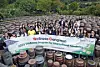 International visitors pose for a group photo against the backdrop of jangdokdae, large ceramic jars used to ferment kimchi, soy sauce and other condiments, at Jung Gang Won on Sept. 20 during Gangwon's Wellness Tour. [PARK SANG-MOON]