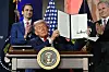 U.S. President Donald Trump displays an executive order on artificial intelligence signed at the ″Winning the AI Race″ summit at the Andrew W. Mellon Auditorium in Washington on July 23. [AFP/YONHAP]