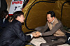 Lee Jun-seok, left, leader of the minor conservative Reform Party, speaks with conservative People Power Party leader Jang Dong-hyeok at his protest site in the National Assembly Rotunda Hall in Yeouido, western Seoul, on Jan. 21, as Jang marks one week of a hunger strike. [NEWS1]