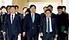 Deputy Prime Minister and Finance Minister Koo Yun-cheol, center, is seen before a meeting of the industrial competitiveness committee and growth strategy task force at the government complex in Sejong on Dec. 16. [NEWS1]