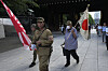 People clad in outdated military uniforms walk towards the main hall of the Yasukuni Shrine, which honors Japan's fallen soldiers, in Tokyo on Aug. 15, 2024, as the country marked the 79th anniversary of its defeat in the World War II. [AP/YONHAP]