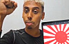 Johnny Somali, real name Ramsey Khalid Ismael, streams with the Japanese Rising Sun Flag displayed on his laptop on Oct. 30. [SCREEN CAPTURE]