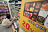 A person selects a ready-made meal for lunch at a convenience store in Seoul on June 18. [NEWS1]