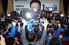 Officials and lawmakers from the liberal Democratic Party at the National Assembly in western Seoul raise their arms to cheer after exit poll results indicated its candidate Lee Jae-myung is likely to win in the presidential election on June 3. [KIM SEONG-RYONG]