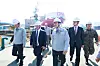 HD Hyundai Executive Vice Chairman Chung Ki-sun, third from left, introduces naval vessels under construction to U.S. Secretary of the Navy John Phelan, second from left, during a tour of HD Hyundai Heavy Industries’ special shipyard in Ulsan on April 30. [HD HYUNDAI]
