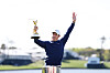 Rory McIlroy celebrates with the trophy after winning the playoff in the final round of The Players Championship on the Stadium Course at TPC Sawgrass on March 17 in Ponte Vedra Beach, Florida. [GETTY IMAGES]