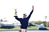Rory McIlroy celebrates with the trophy after winning the playoff in the final round of The Players Championship on the Stadium Course at TPC Sawgrass on March 17 in Ponte Vedra Beach, Florida. [GETTY IMAGES]