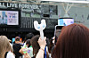Fans take pictures of the K-pop goods of girl group NewJeans before a meet and greet event held on June 27 at the Tokyo Dome in Japan. [YONHAP]