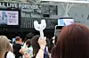 Fans take pictures of the K-pop goods of girl group NewJeans before a meet and greet event held on June 27 at the Tokyo Dome in Japan. [YONHAP]