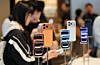 A customer looks at an iPhone 17 model on display at the Apple Store in Myeong-dong, central Seoul, on Sept. 19. [NEWS1]