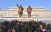 North Koreans visit the statues of late North Korean leaders Kim Il-sung, left, and Kim Jong-il on the occasion of the Lunar New Year in this image provided by the Korean Central News Agency on Jan. 30. [KOREAN CENTRAL NEWS AGENCY]