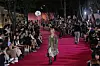 Models walk along the stonewall path of Deoksu Palace in central Seoul during Andersson Bell’s show, which opened the 2026 Spring/Summer Seoul Fashion Week on Monday. [YONHAP]