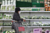 A customer shops for vegetables at a discount mart in downtown Seoul on Sunday. [YONHAP]