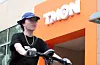A pedestrian cycles by TMON's headquarters in Gangnam District, southern Seoul, on Tuesday. [NEWS1]