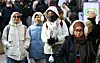 Tourists walk down the streets of Myeongdong, central Seoul, on Dec. 21, 2025. [NEWS1]