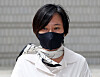 Jang Si-ho, niece of Choi Seo-won, formerly known as Choi Soon-sil, walks out of Seoul High Court in Seocho District, southern Seoul on July 24, 2020. [YONHAP]