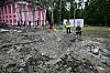 Police experts work on a crater at a children's railway near the central park of Kharkiv following an aerial attack, in Kharkiv on June 7, amid the Russian invasion in Ukraine. [AFP/YONHAP]