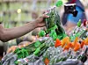 A person shops for vegetables at a discount mart in Seoul on June 4. [NEWS1]