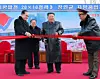 North Korean leader Kim Jong-un, center, cuts the ribbon at the inauguration ceremony for regional factories in Jangyon County, South Hwanghae Province, on Dec. 18, in this photo published by the Korean Central News Agency on Dec. 19. [KCNA]