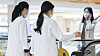 Hospital staff take the escalators at a hospital in Seoul on Wednesday. [YONHAP]