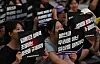 Protesters demonstrate against illegal deepfake content in Jung District, central Seoul, on Friday. [NEWS1]