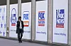 A man walks past the News Corp. and Fox News headquarters in New York on April 19, 2023. [AP/YONHAP]