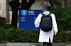 A student walks across a medical school campus in downtown Seoul on May 9. [NEWS1]