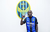 Mo Barrow poses in front of the Incheon United logo in a photo shared by the K League 2 club on Feb. 3.  [INCHEON UNITED]