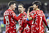 Mainz's Lee Jae-sung, right, celebrates with Anthony Caci, left, after scoring the third goal of a Bundesliga match against Holstein Kiel in Kiel, Germany on Sunday.  [AP/YONHAP]