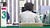 A customer consults with a bank teller in downtown Seoul on Aug. 8. [NEWS1]