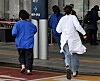 Medical professionals run into a hospital in Seoul on Tuesday. [NEWS1]