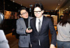 Han Dong-hoon, center, former leader of the People Power Party, ignores a reporter's question during his visit to a movie theater in western Seoul on Jan. 28.  [YONHAP]