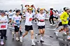 Ten-kilometer course runners wearing Disney hats at the inaugural Disney Run Seoul 2025 pose for a photo while crossing the Seogang Bridge on Oct. 11. [WALT DISNEY COMPANY KOREA]