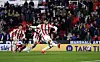Stoke City midfielder Bae Jun-ho, far left, runs as his teammate Tom Cannon takes a shot during a Championship match against Portsmouth at bet365 Stadium in Stoke-on-Trent, England on Wednesday. [AP/YONHAP]