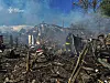 In this photo provided by the Ukrainian Emergency Service, firefighters extinguish a fire following Russia's air raid in the village of Bilopillya in the Sumy region, Ukraine, Wednesday, May 14, 2025. [AP/YONHAP]