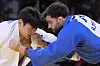 Korea's Han Ju-yeop and Brazil's Rafael Macedo compete in a men's -90-kilogram repechage round match at the Champ-de-Mars Arena in Paris on Wednesday. [AP/YONHAP]