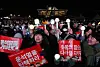 Protesters wave light sticks of various K-pop groups during a rally demanding President Yoon Suk Yeol's impeachment in front of the National Assembly in Yeouido District, western Seoul, on Saturday. [YONHAP]