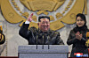 North Korean leader Kim Jong-un, center, is seen alongside his daughter Kim Ju-ae during a military parade marking the Ninth Party Congress of the Workers' Party at Kim Il Sung Square in Pyongyang on Feb. 25, in this photo carried by the state-run Korean Central News Agency. [YONHAP]